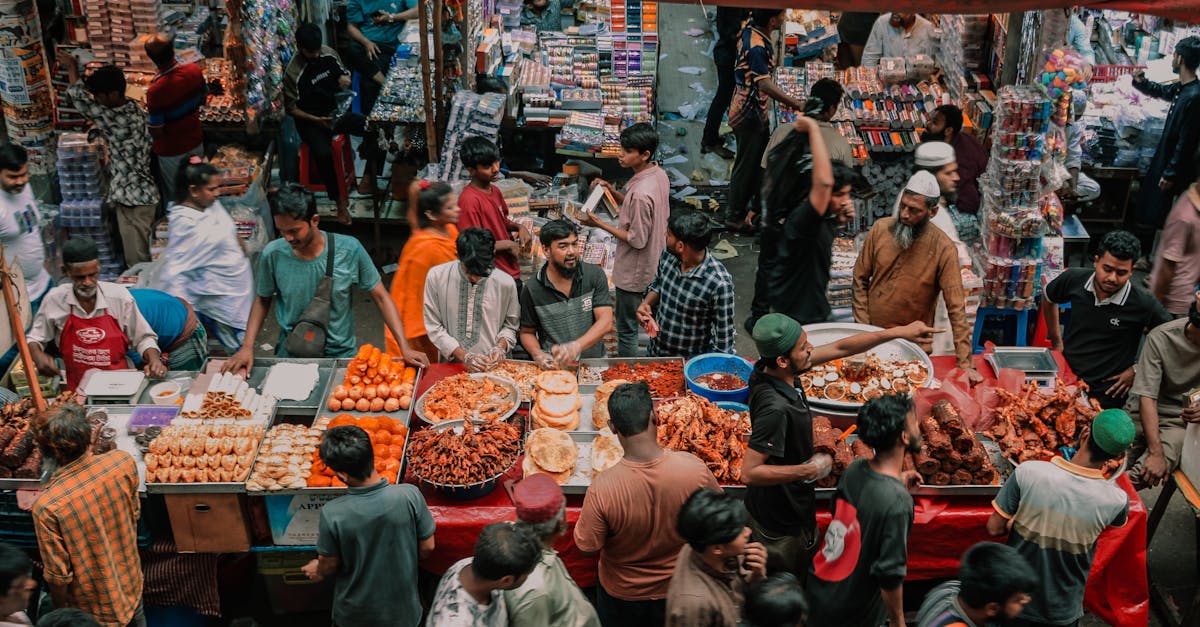 Vibrant street market filled with people and diverse street food stalls, capturing local culture.