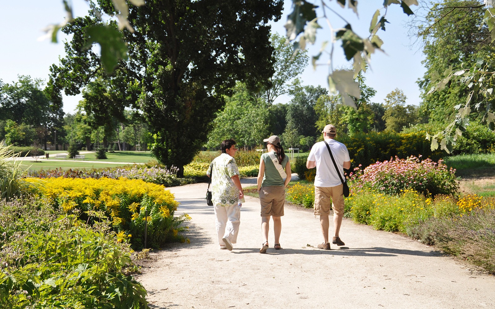 Visitors walking through gardens at Gödöllő Royal Palace near Budapest.