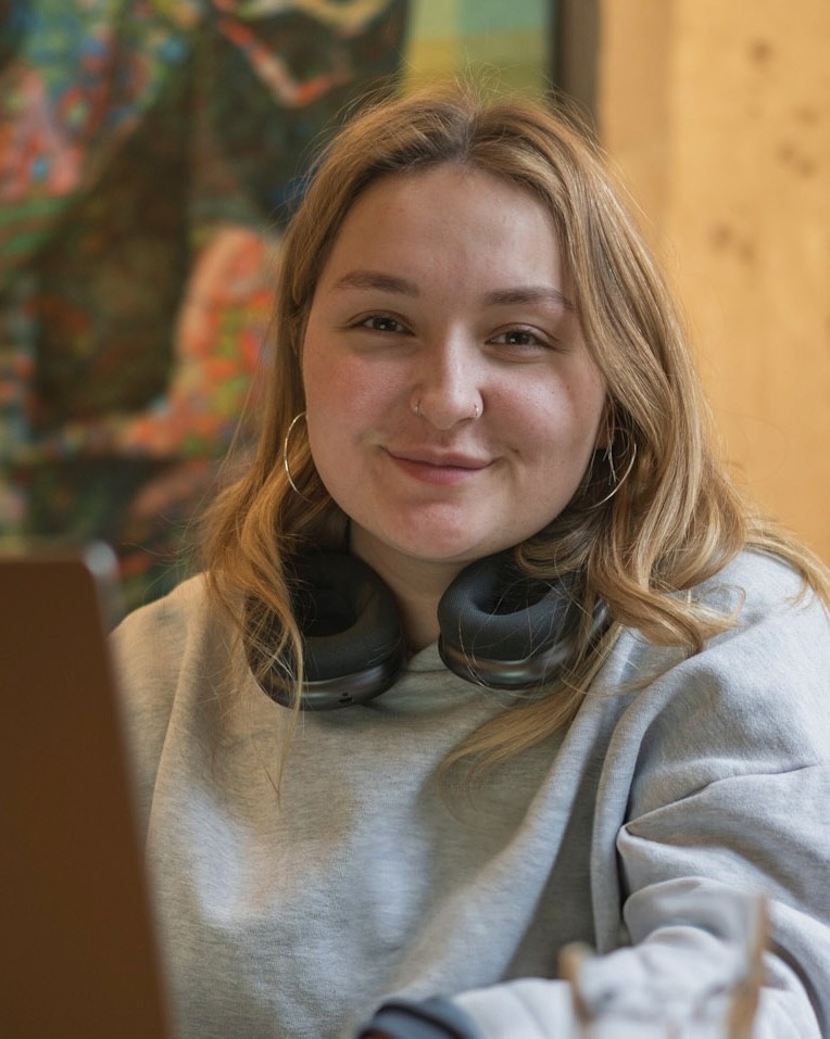Young woman smiling at someone