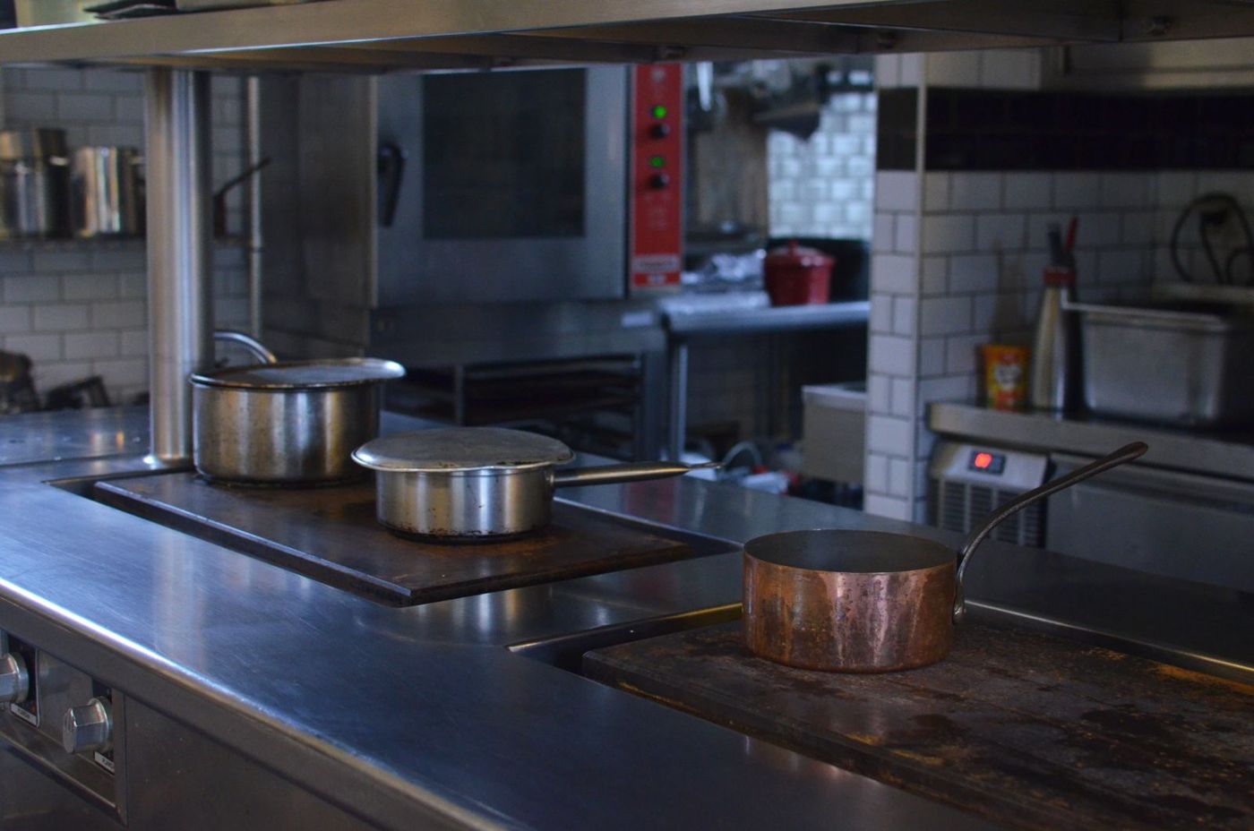 Stainless steel prep table in a restaurant kitchen