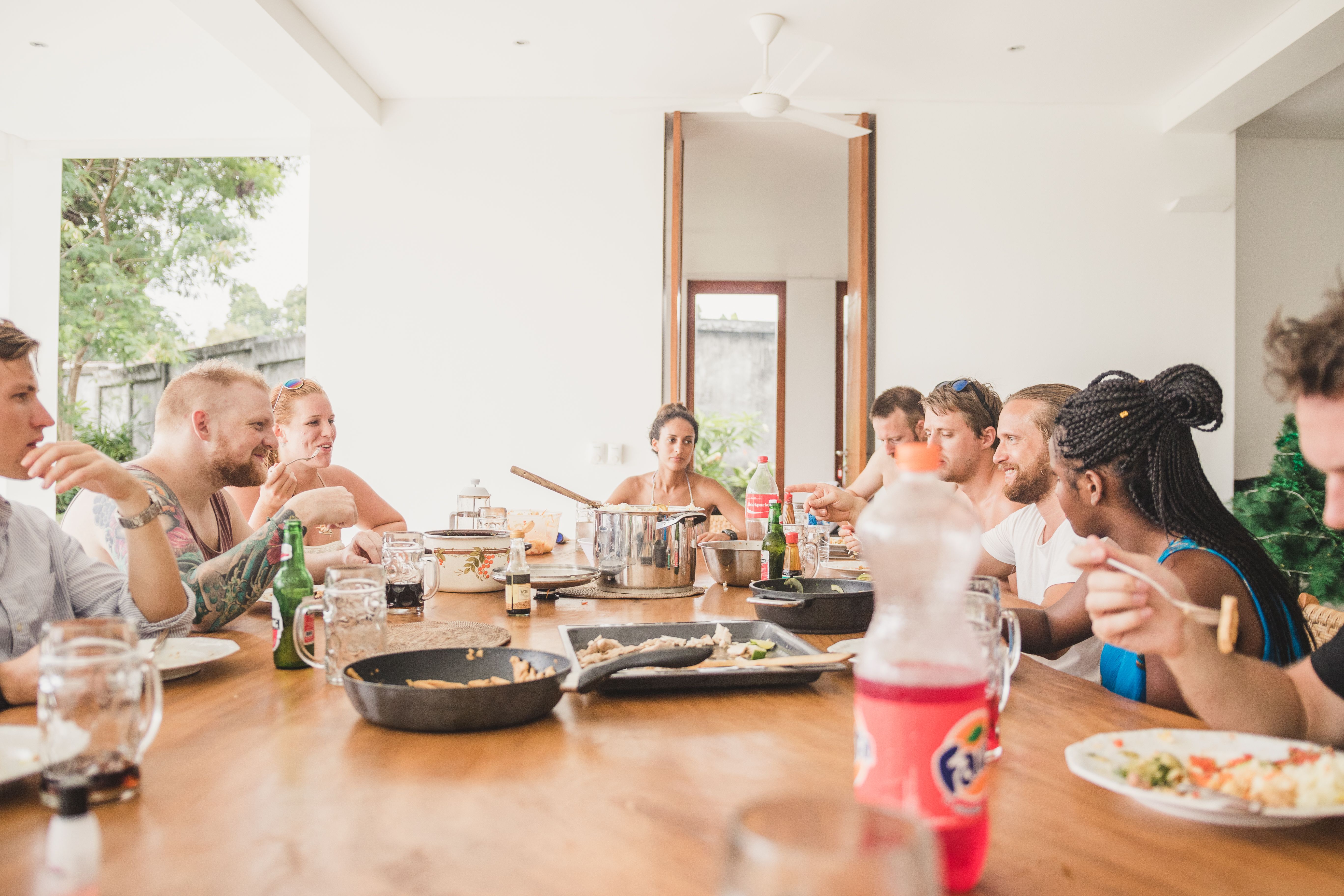 A group sharing a meal around a long table