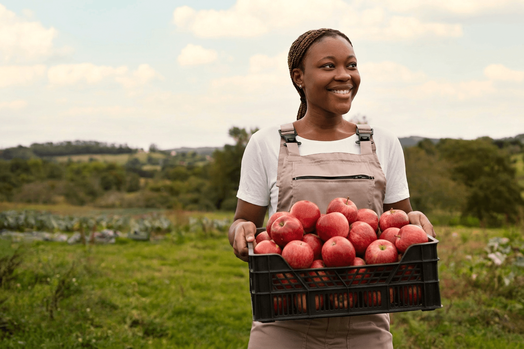 woman smiling with farm harvest