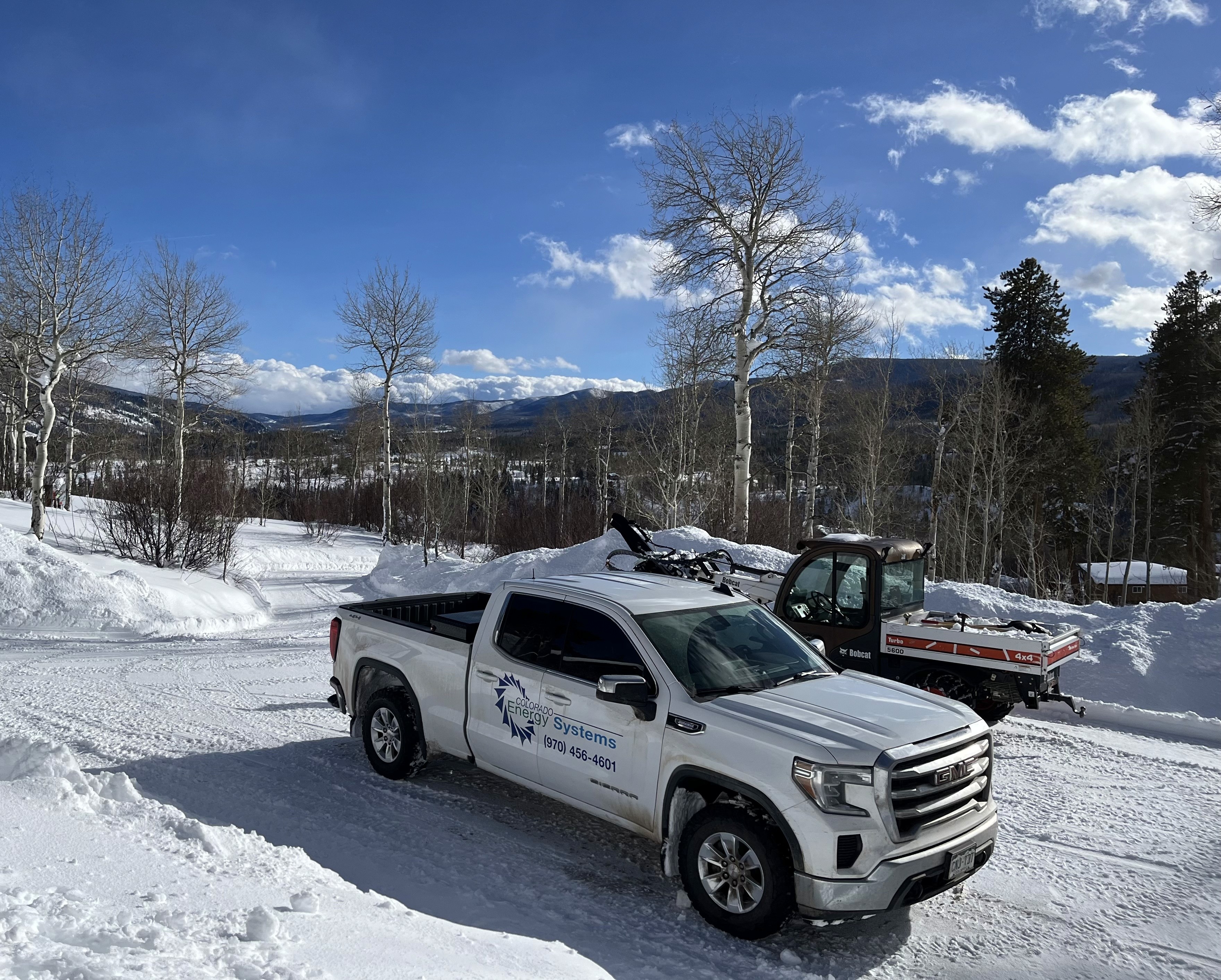 Colorado Enery Systems' company vehicles in snowy landscape