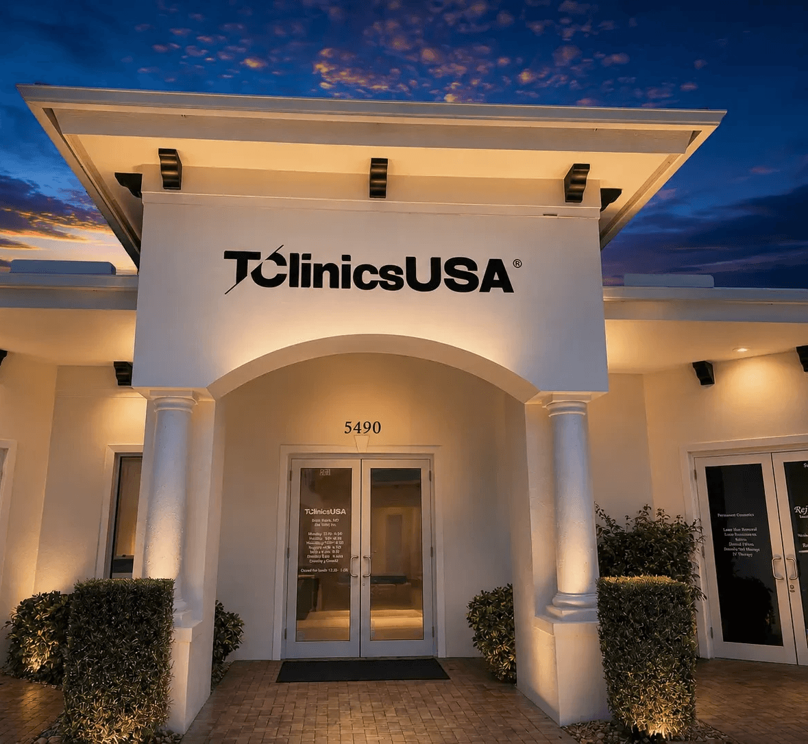 T Clinics USA clinic entrance illuminated at dusk