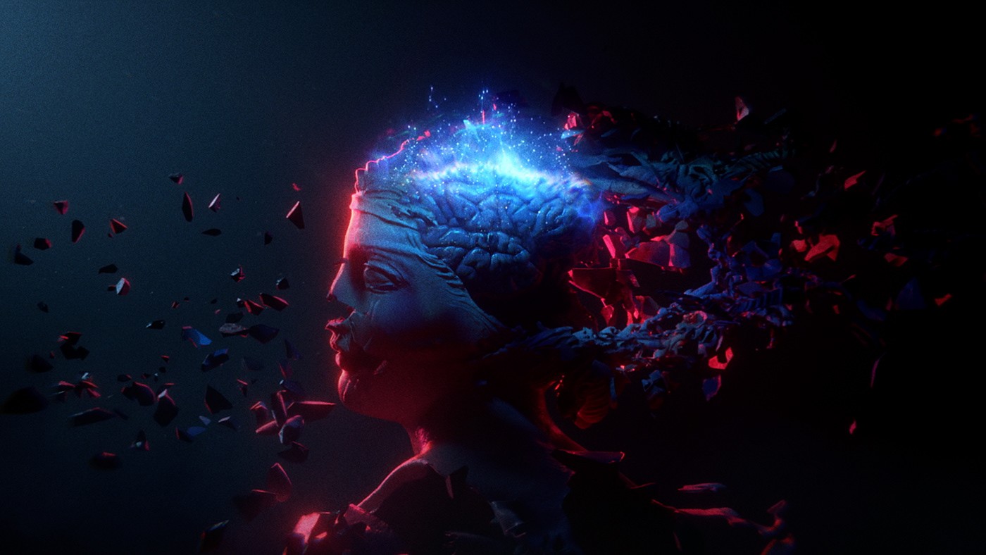 A young person with long, wavy hair sits in front of a plain background, looking directly at the camera.