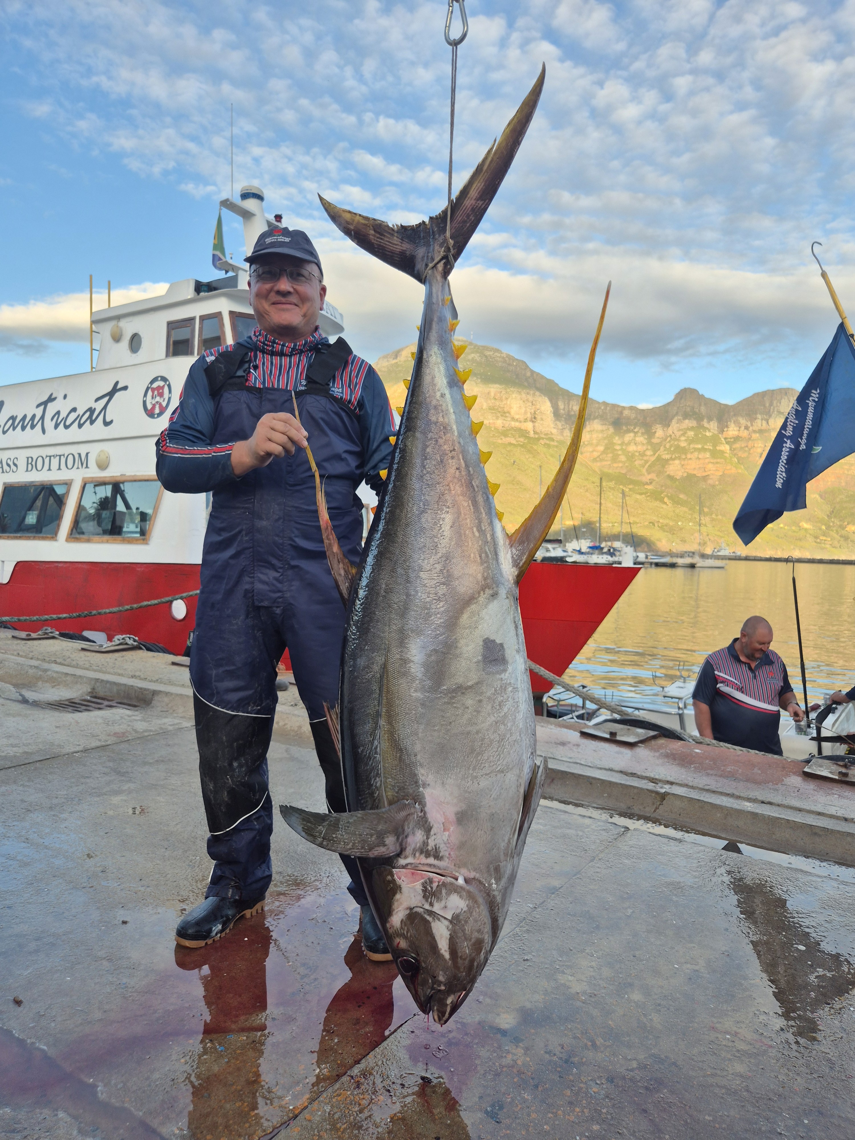 Fishermen celebrating a successful catch on a Salt Safari charter.