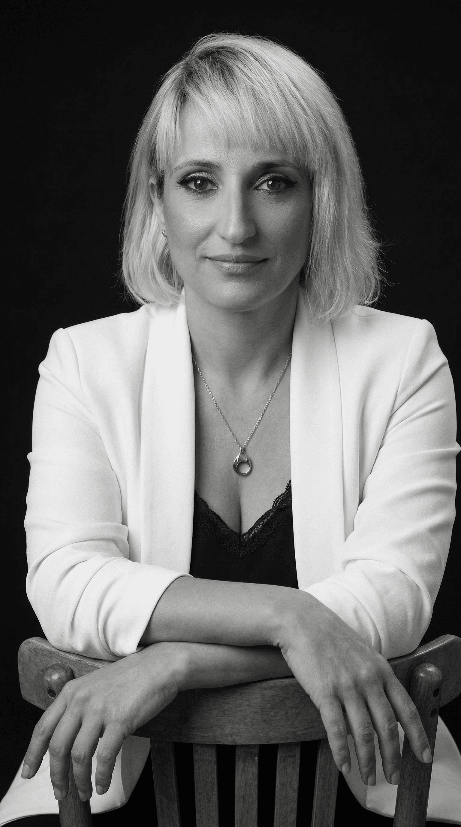 Rachel Stone, personal trainer and fitness coach, smiling in natural light