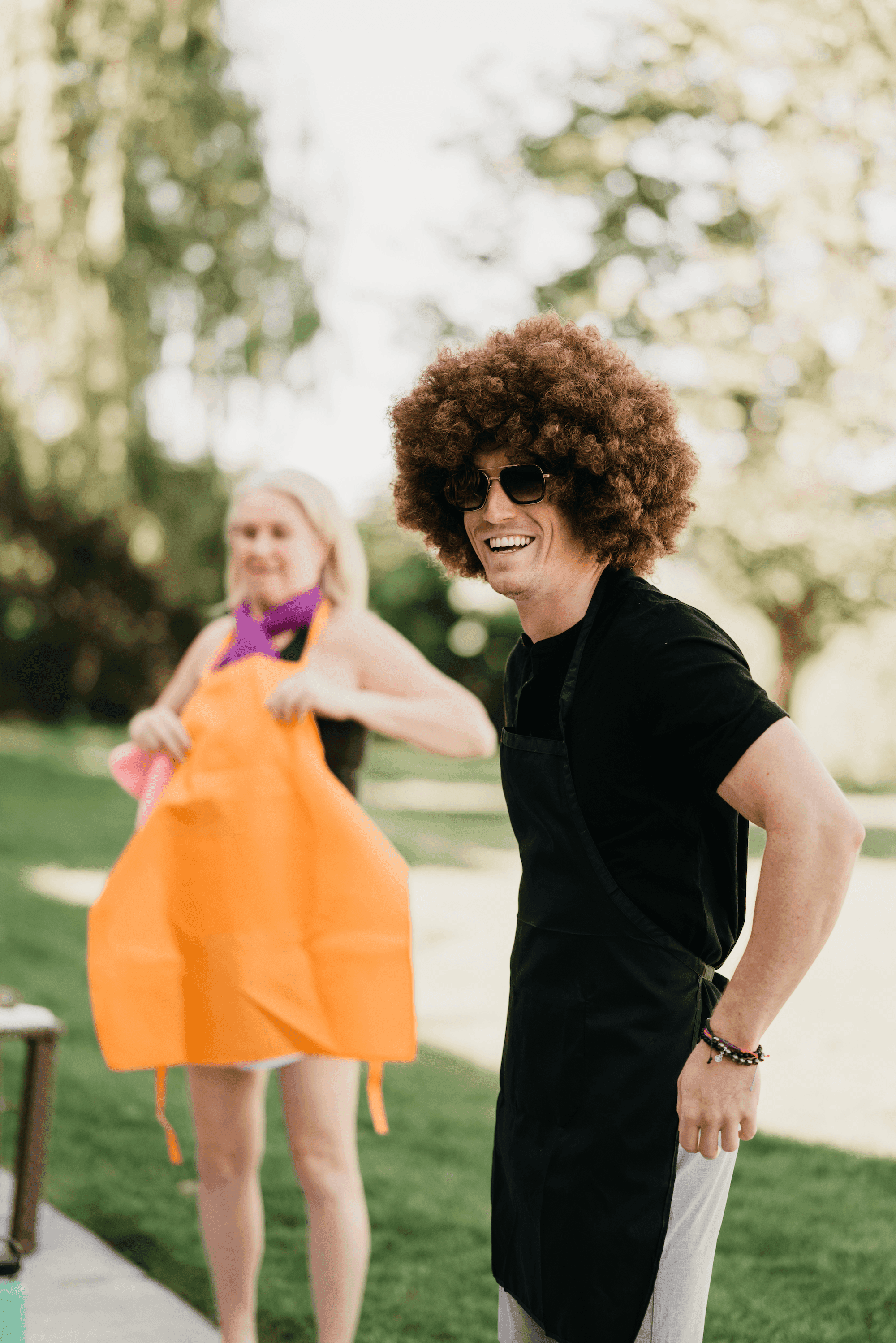 a beautiful image of a hand puting one dollar into a piggy bank on a light grey background with studio lighting
