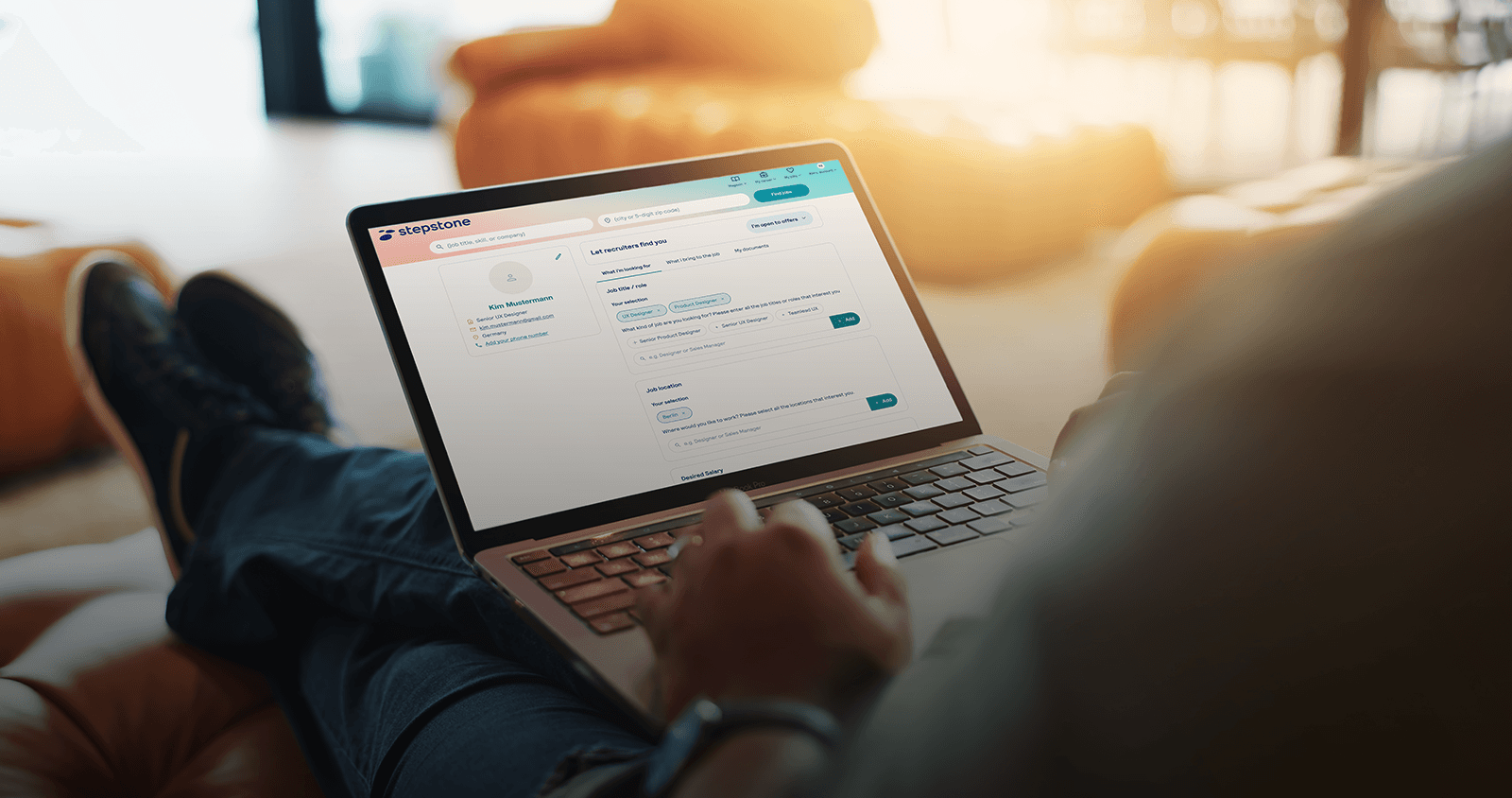 person sitting on the sofa with a laptop - screen showing a very long form