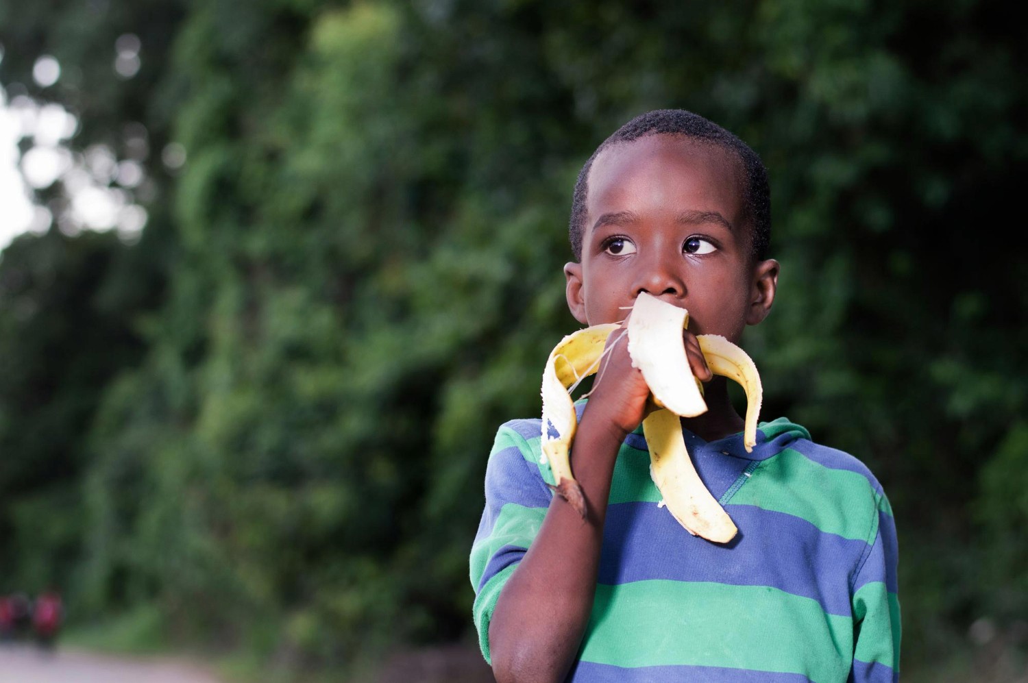 a group of children standing around each other