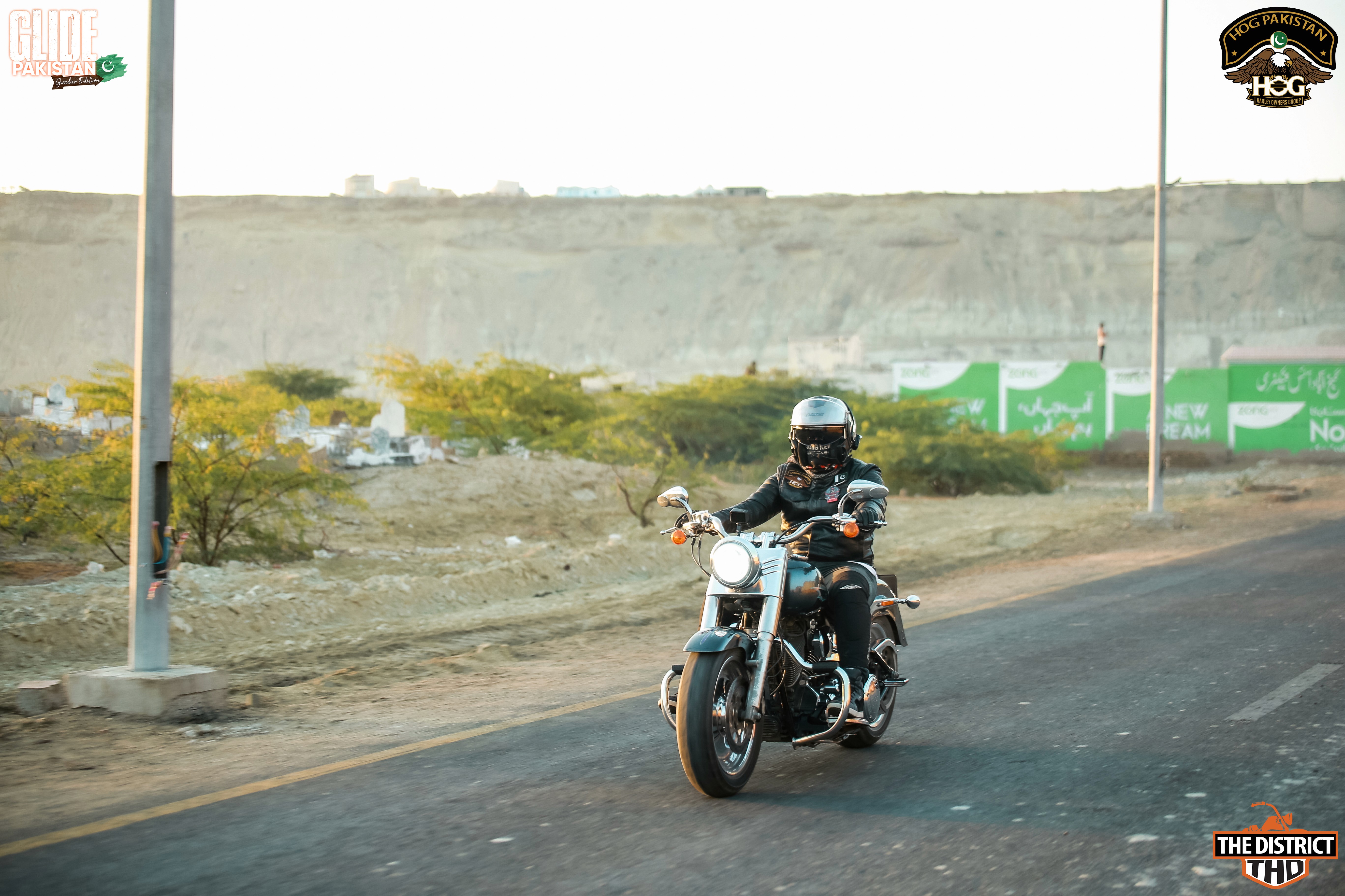 person riding cruiser motorcycle during daytime