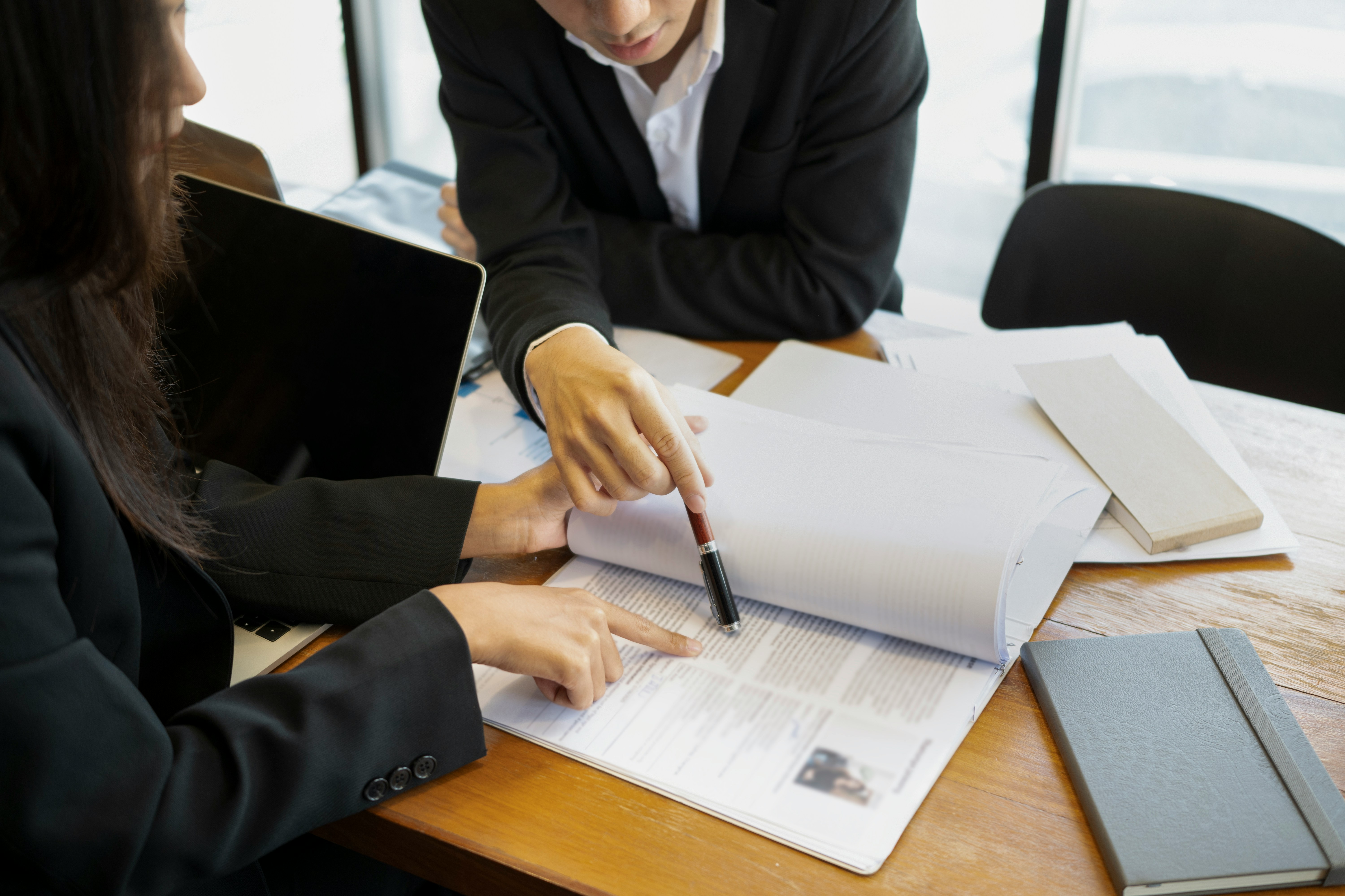 Recruiters reviewing a resume together during a hiring process.