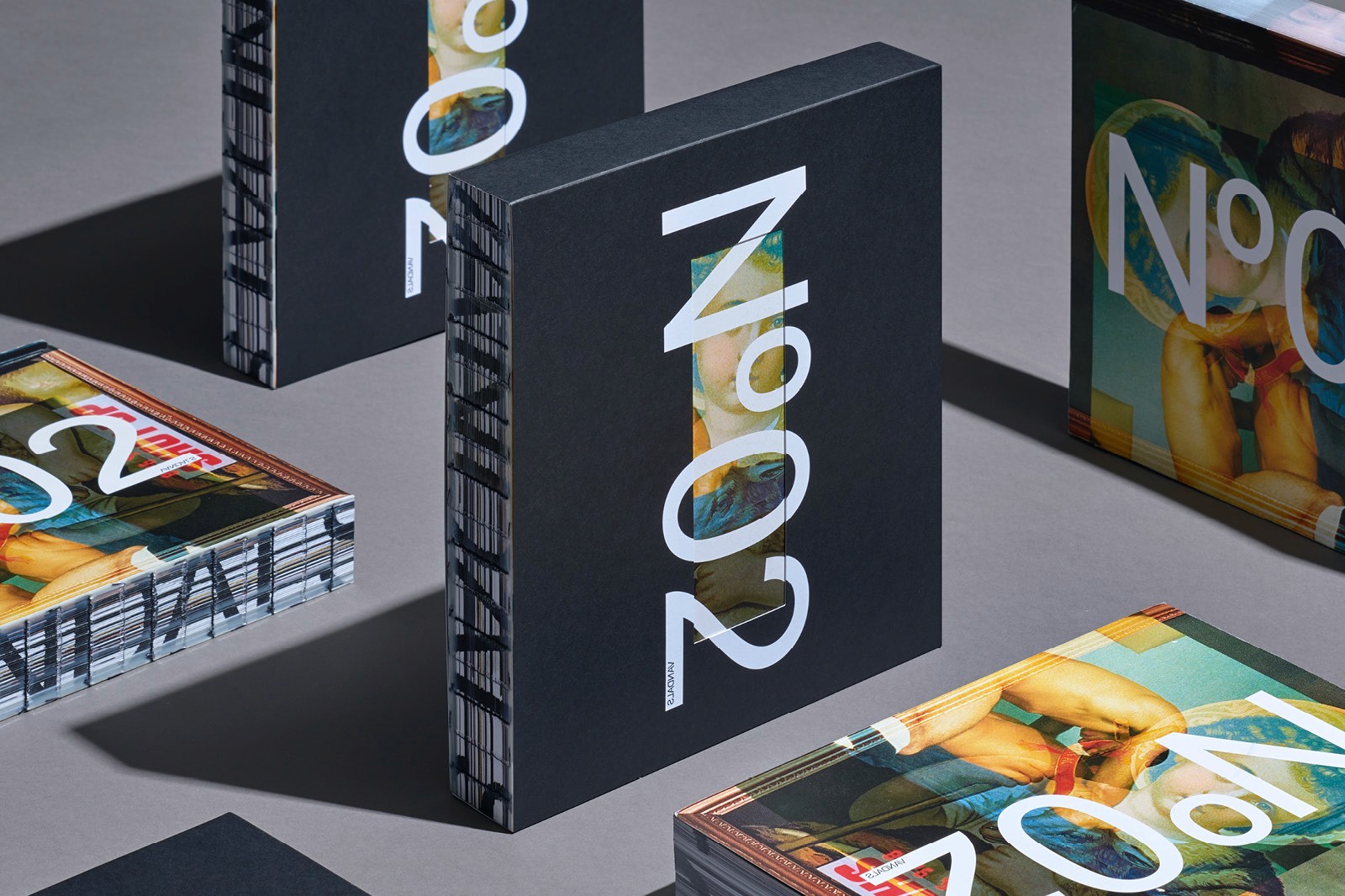 A collection of VANDALS magazine, prominently featuring the title No.02 on a dark background.