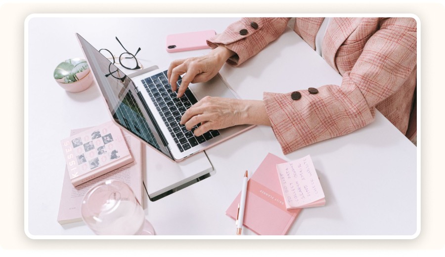 Person typing on a laptop at a desk