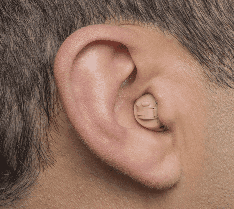 Doctor checking a male patient's hearing