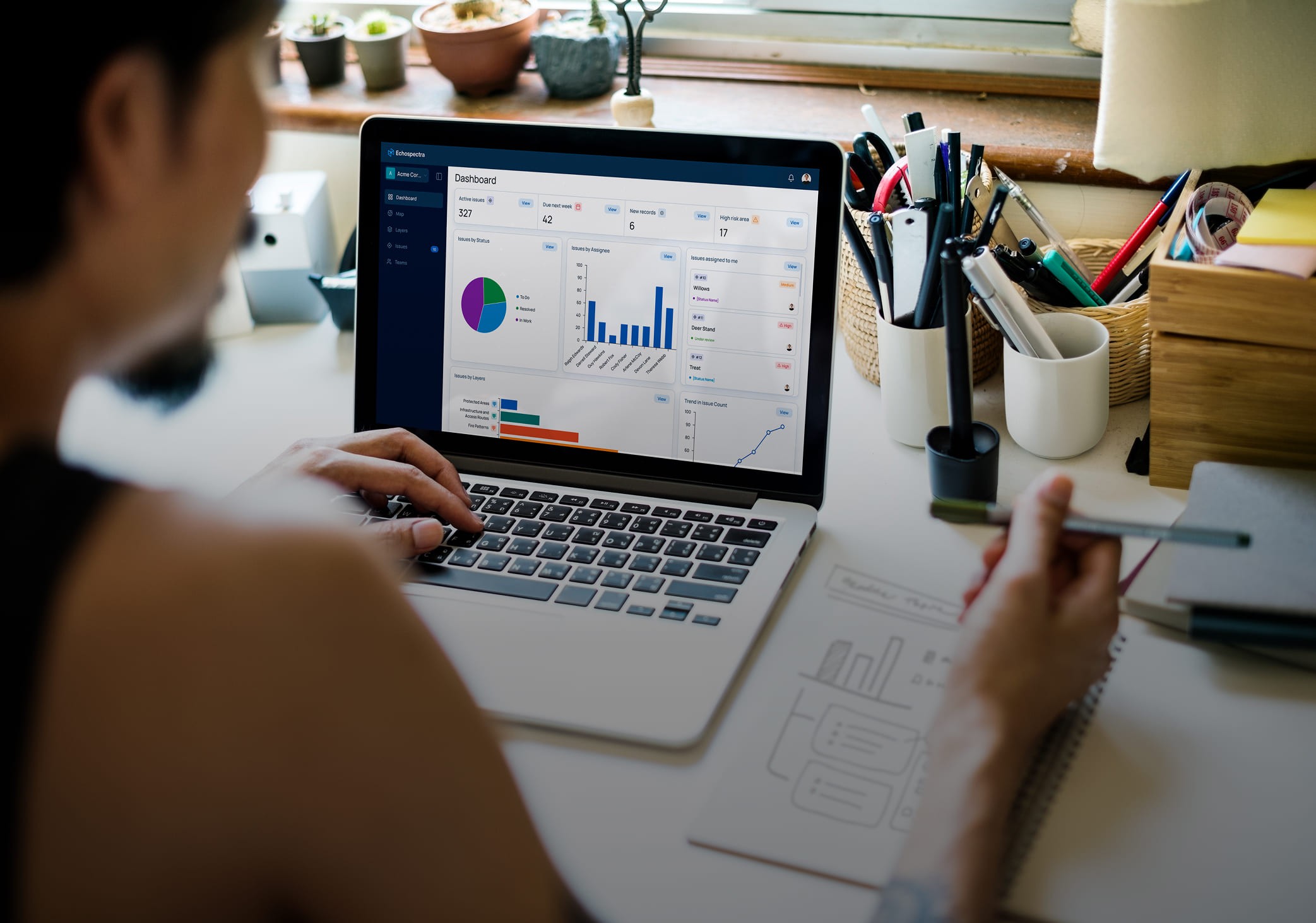 Person analyzing data dashboards on a laptop
