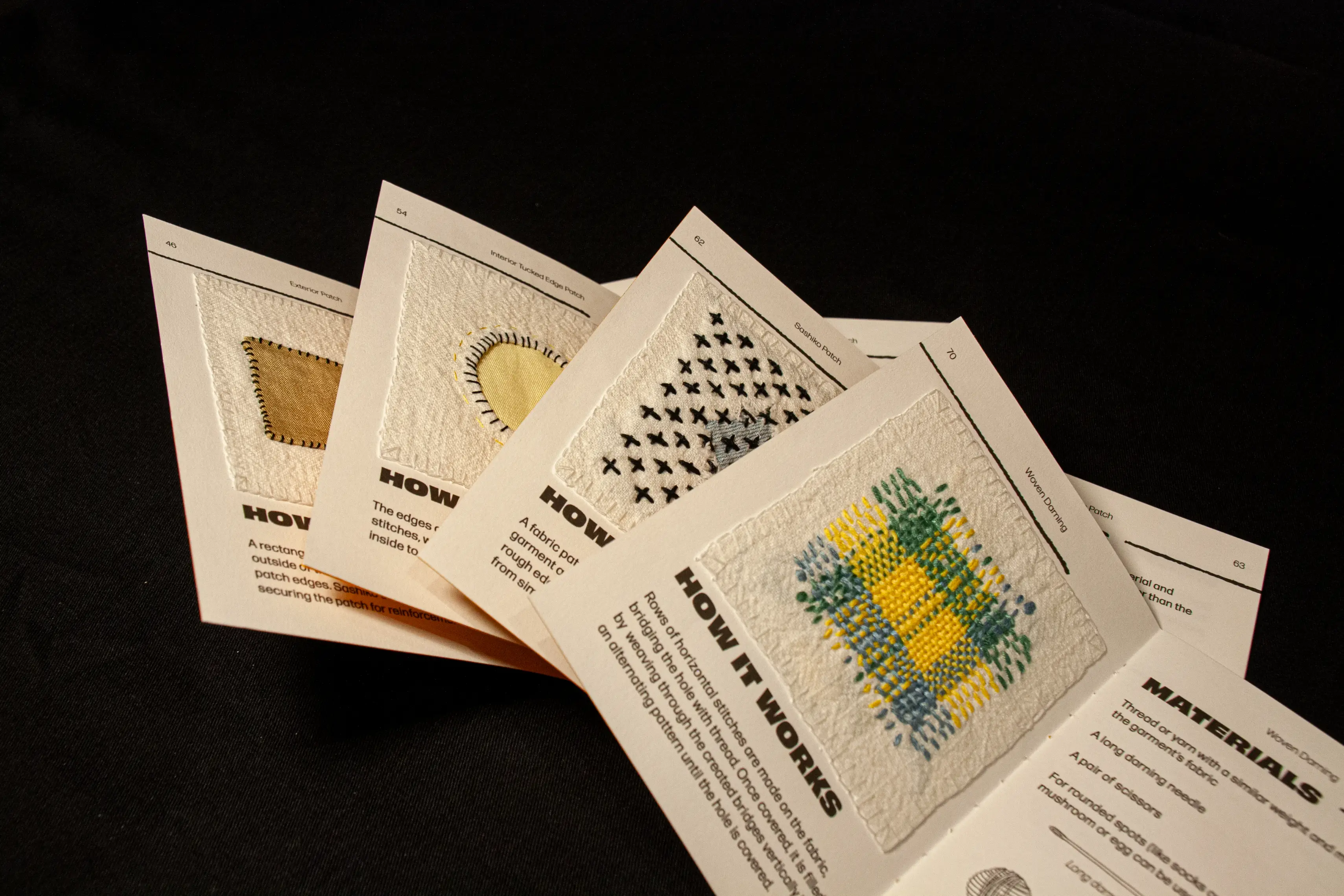 Physical examples of mending methods attached to booklet pages