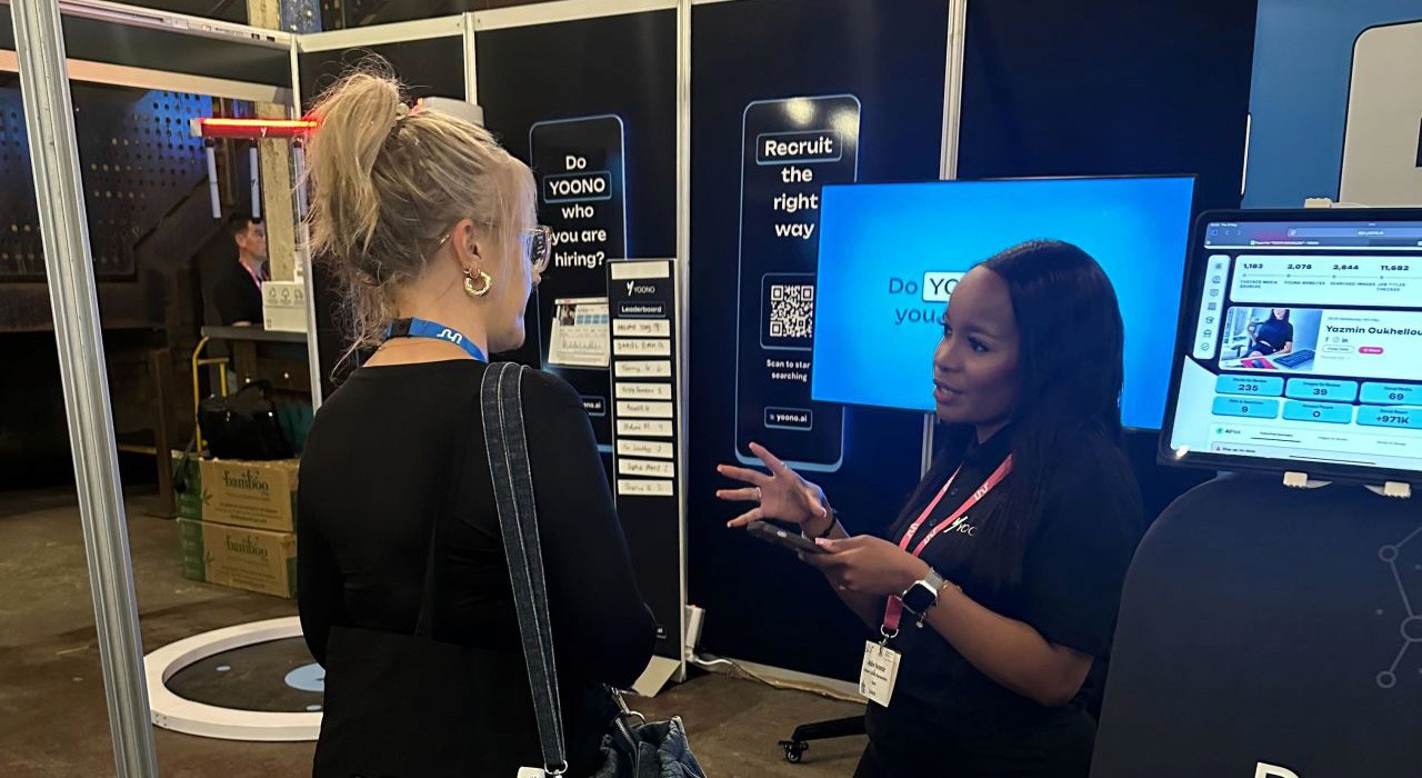 YOONO staff talking to attendees