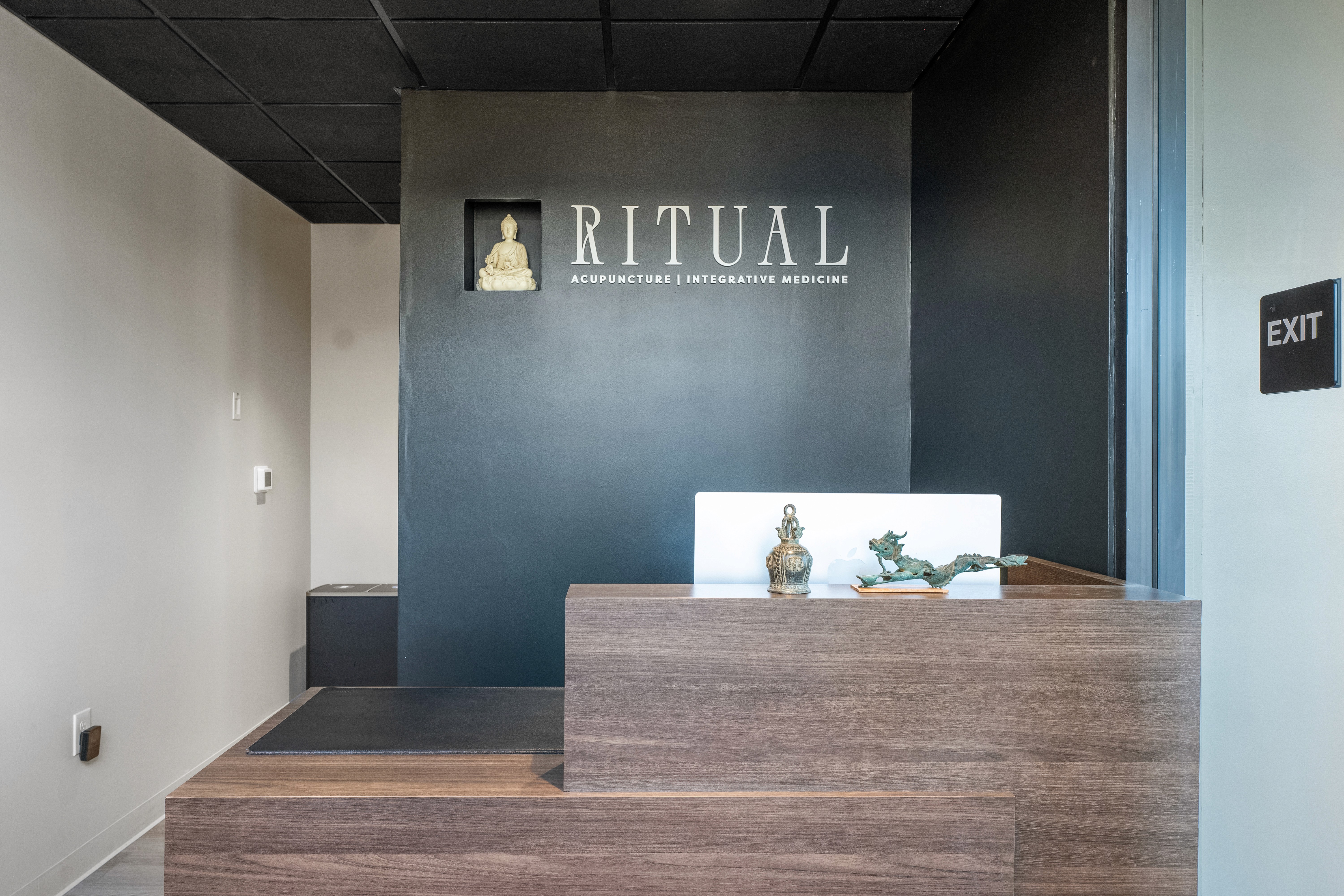 “Gray kitchen remodel with quartz island, stainless steel appliances, and patterned tile backsplash”