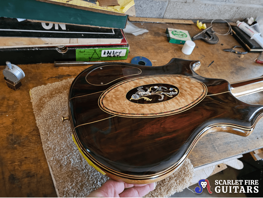 Jerry Garcia's original tiger guitar on the workbench (body back, angled), Doug Irwin's shop