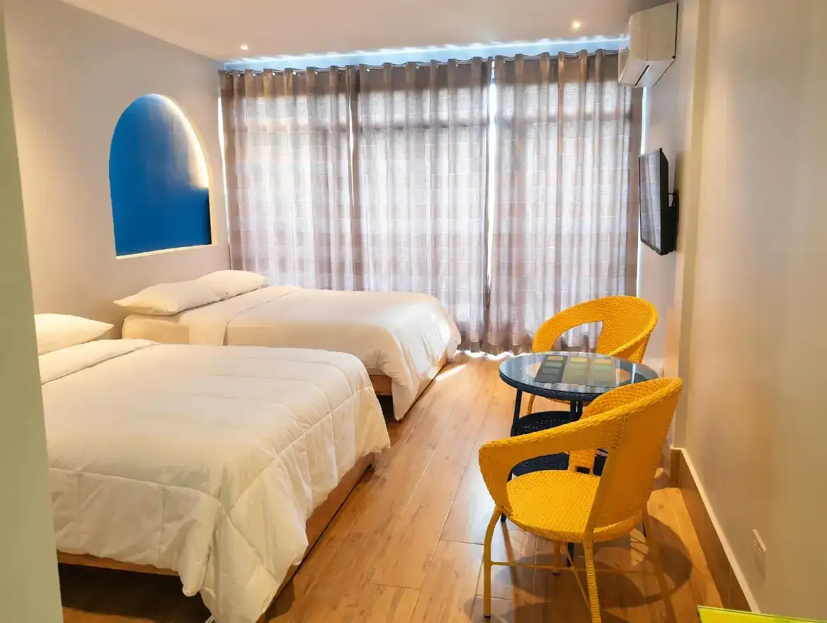 Spacious Family Room with two beds and pool access at Oktowaves Hotel Nasugbu