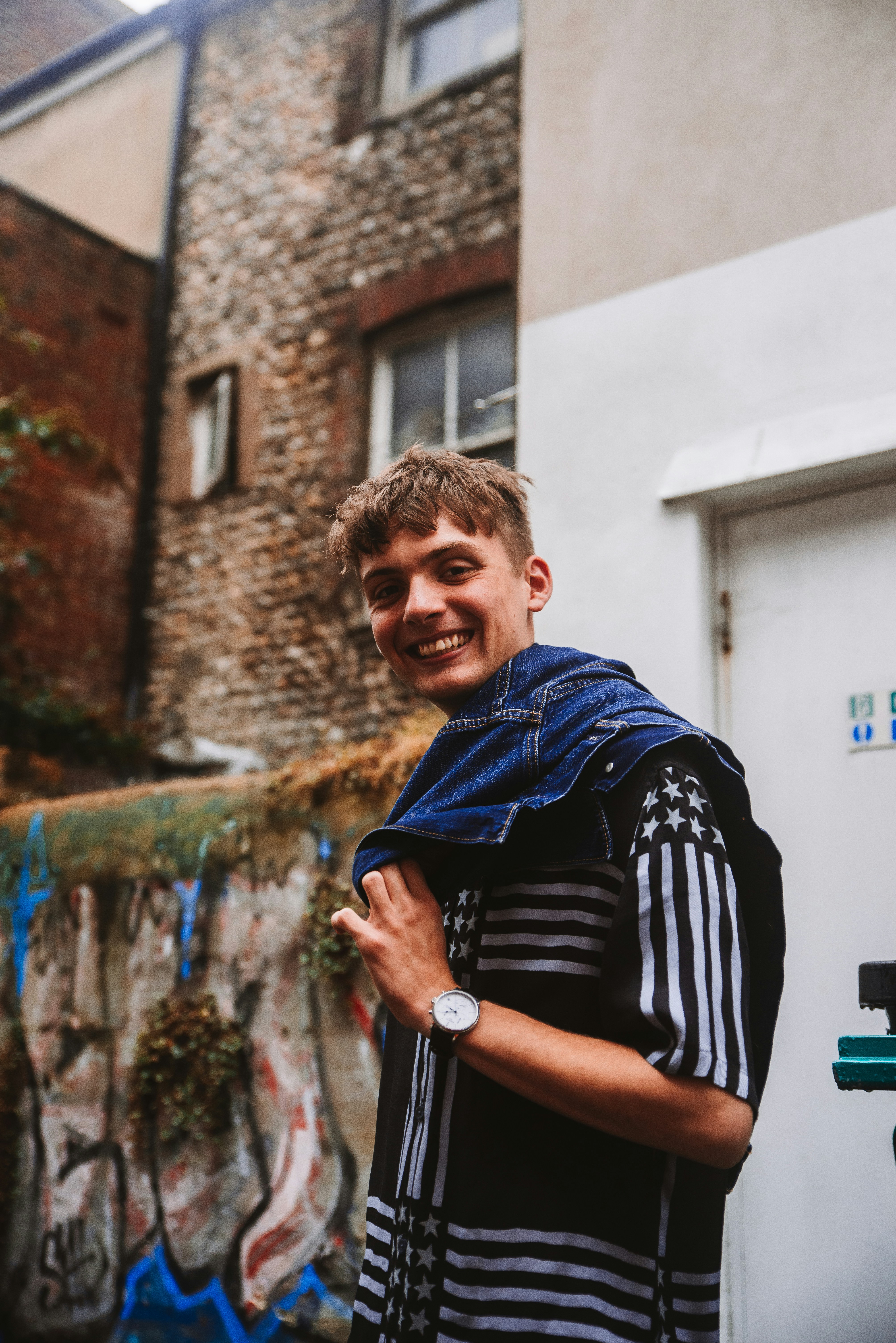 A candid photo of a smiling young man, representing an individual **user persona** within a target market