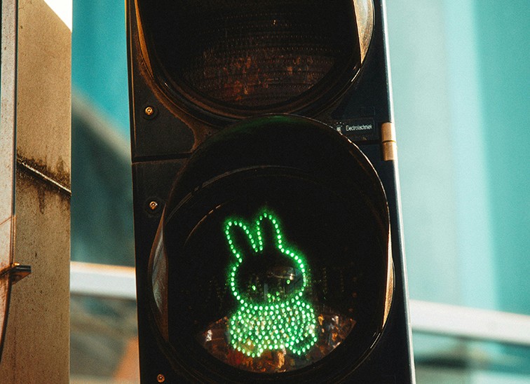 Green bunny-shaped traffic light glowing, symbolizing a fresh start and new direction for brand identity.