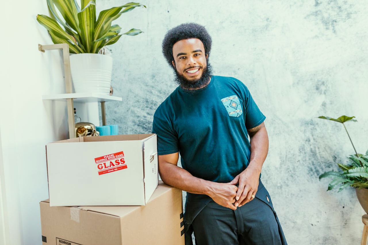 Moving company worker smiling at the camera.