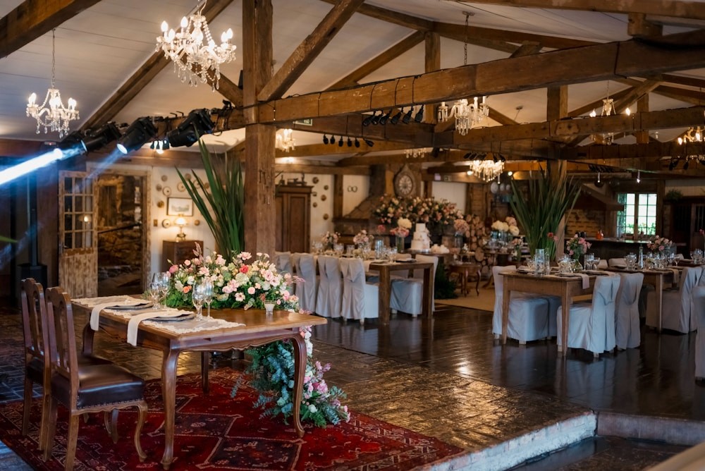 Event hall decorated with flowers and wooden beams at Solmere Hall