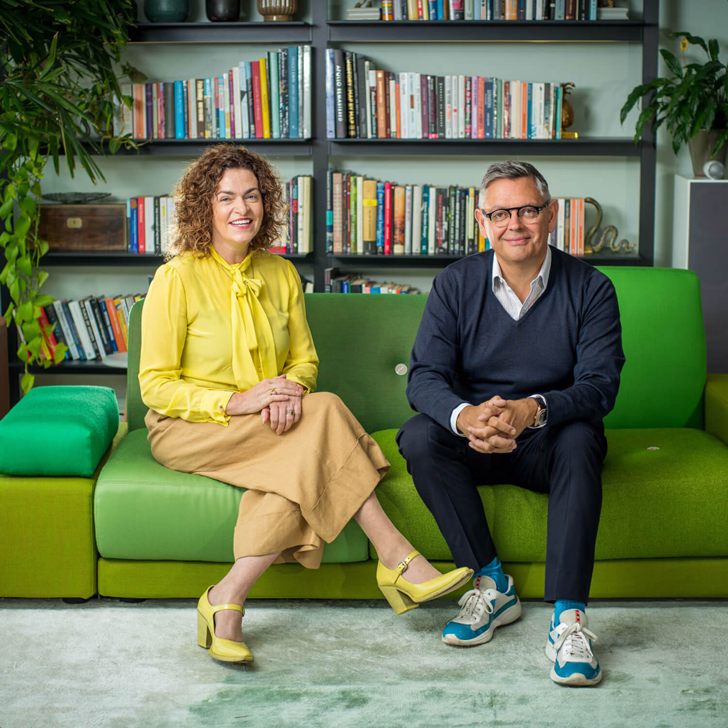 Two AI startup founders sitting on a sofa