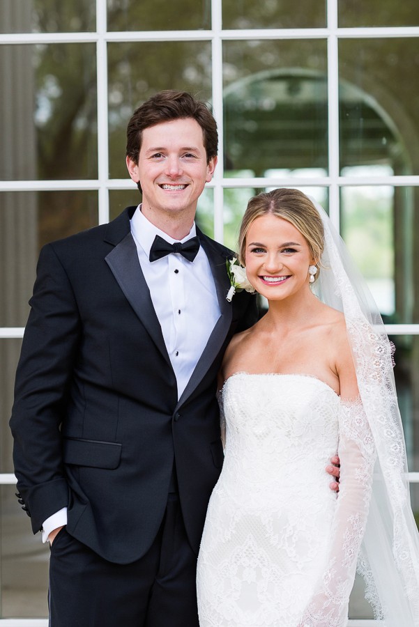 Bride and groom portrait with vintage car at the Swan House in Atlanta Georgia.