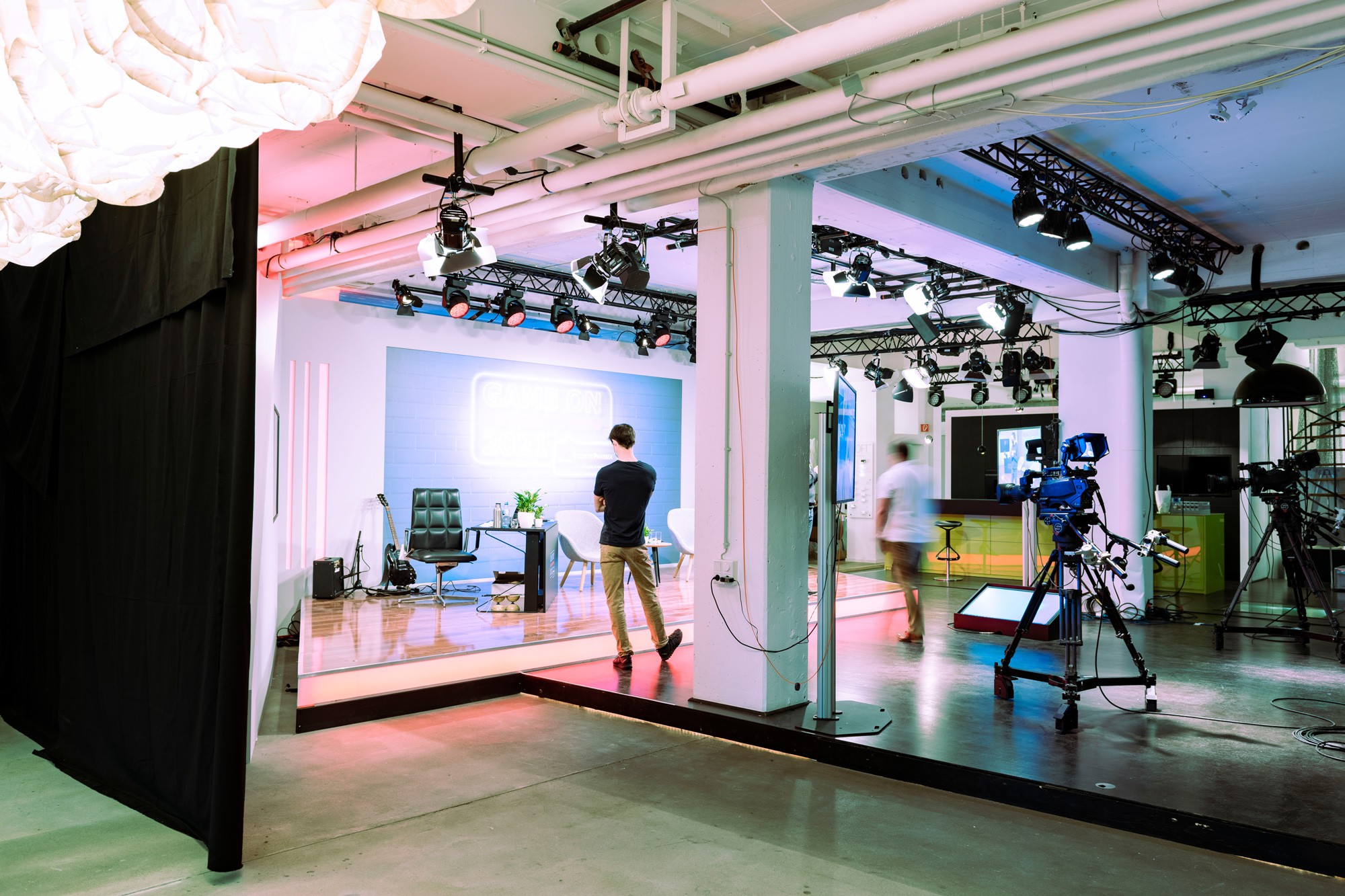 Young black woman witting at the table working on a laptop