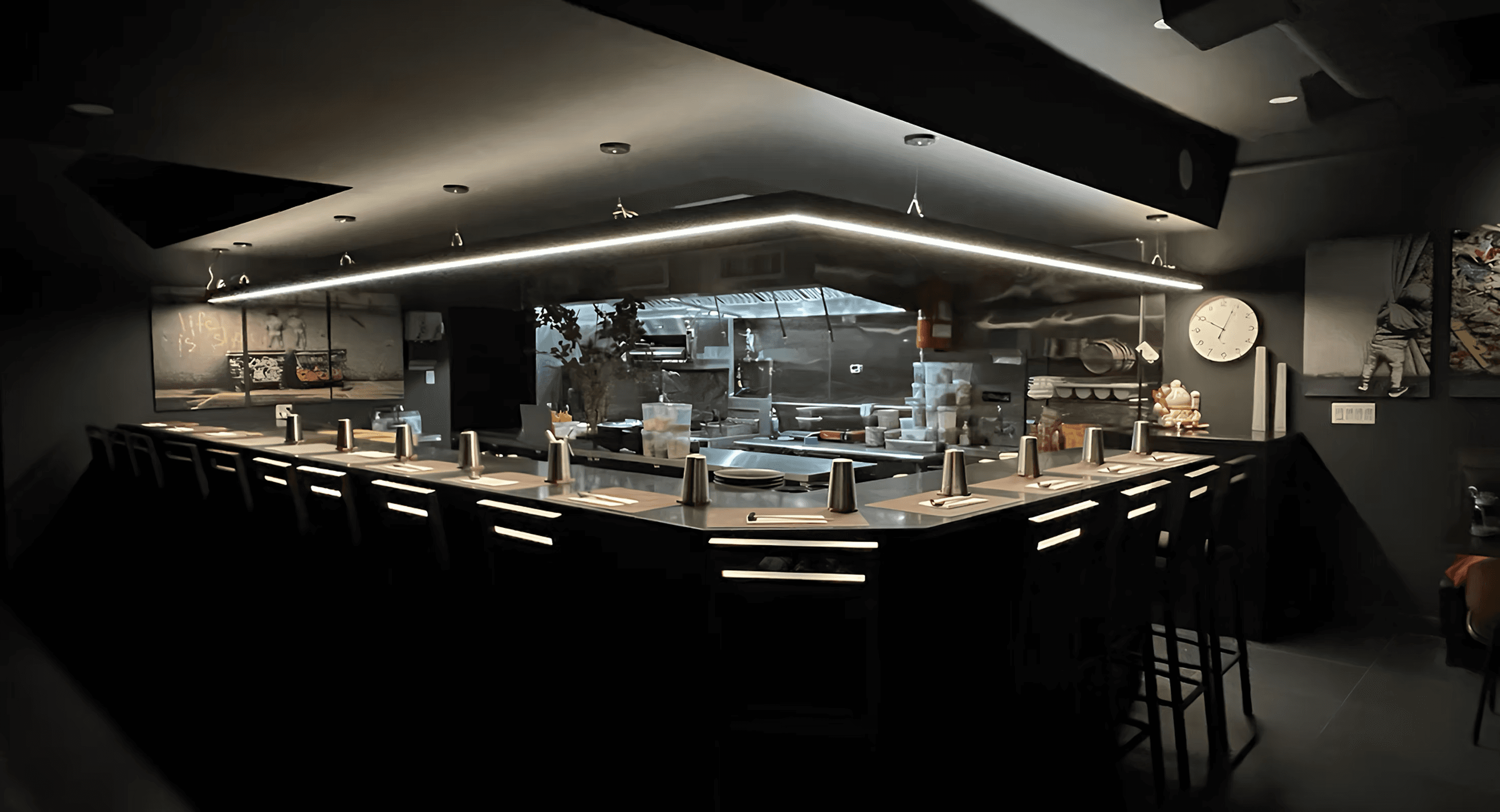 A sleek and modern omakase dining setup at Toka Chef in New York City, featuring an intimate counter seating arrangement and a well-lit open kitchen where Chef Derek prepares each dish.