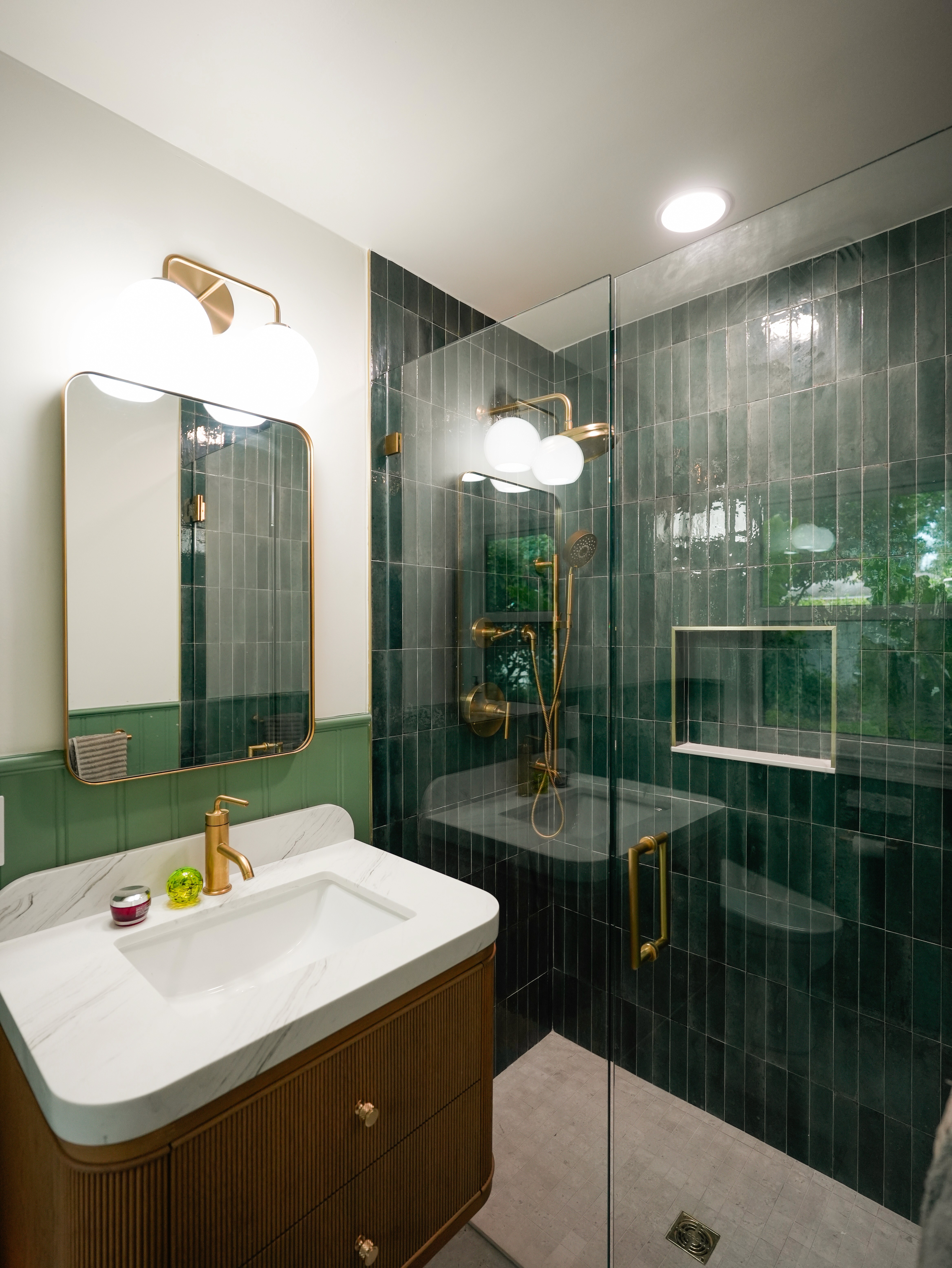 Free Standing Vanity, gold plumbing fixrtures, green small format tile