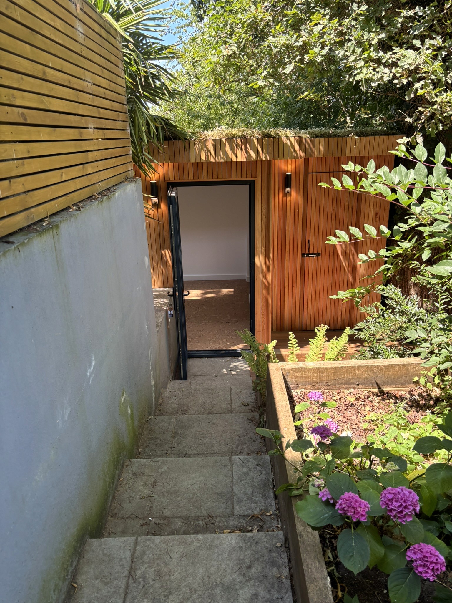 Hidden Yoga Studio in Crystal Palace. Western red cedar battens garden room by Eleven Trees.