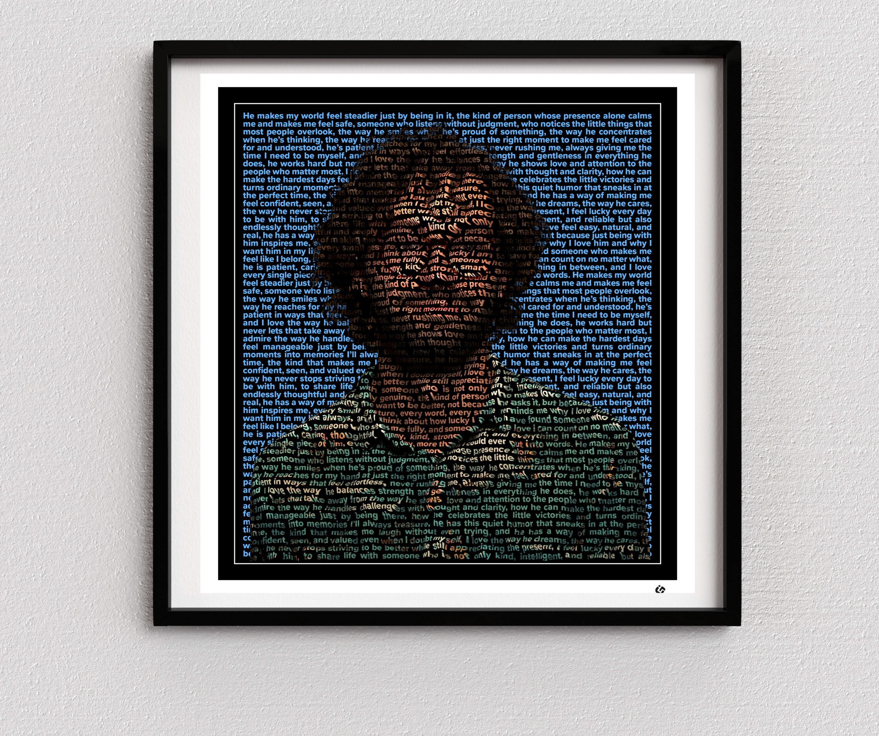 Custom text portrait of a man smiling in a warm, intimate photo, with his entire silhouette formed from repeated love-letter text. The artwork is framed with a thin white line, bold black border, and white mat, with a minimal black logo in the bottom-right corner.