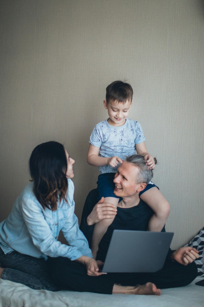 Established newcomer family smiling together while optimizing their long-term Canadian finances