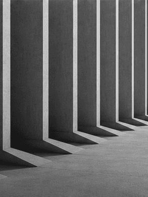 Repeating architectural forms creating a consistent geometric pattern, representing cadence, structure and execution.