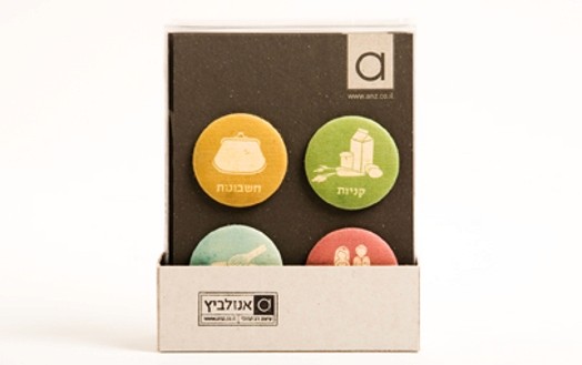 Buttons with fabric covers and different icons, like food, people, signs, etc.