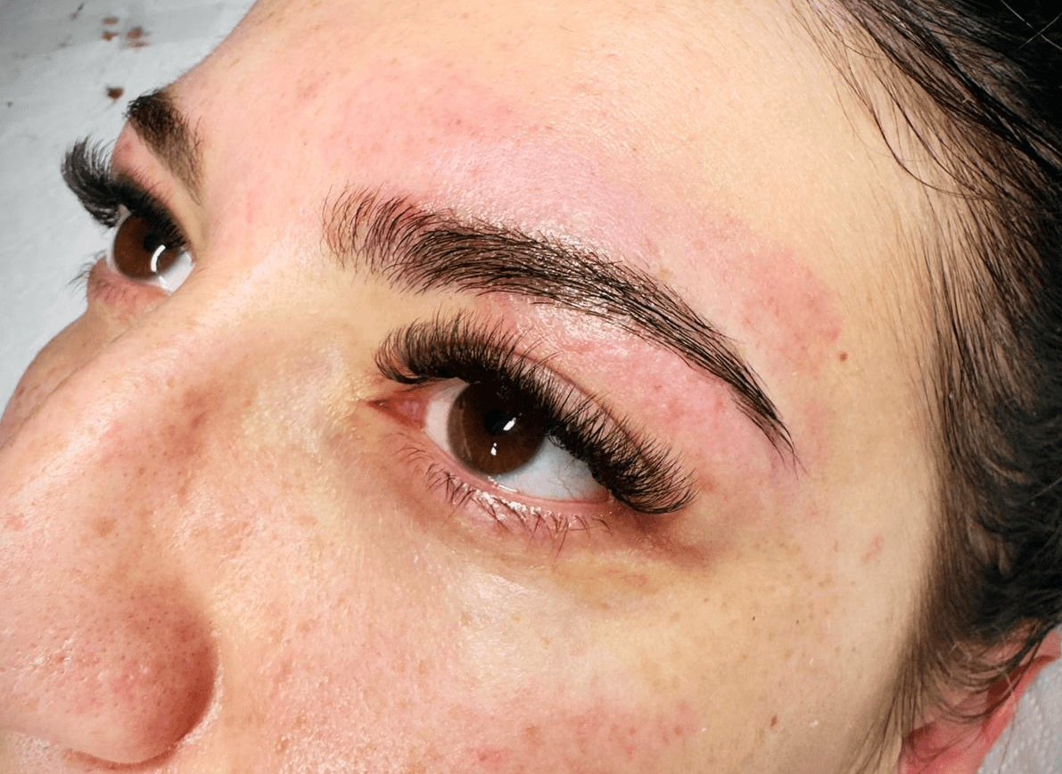 makeup powder with blush and a brush