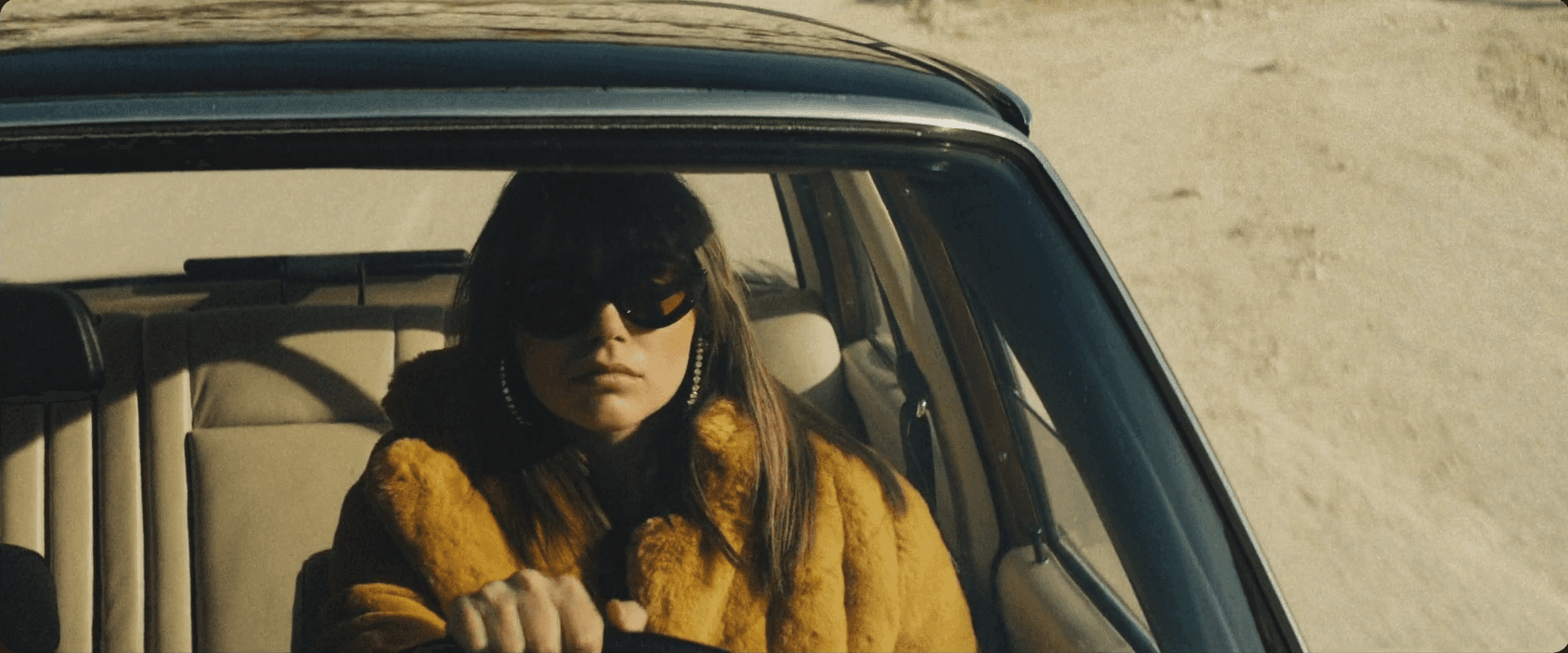 Silhouette of a person walking on a modern walkway