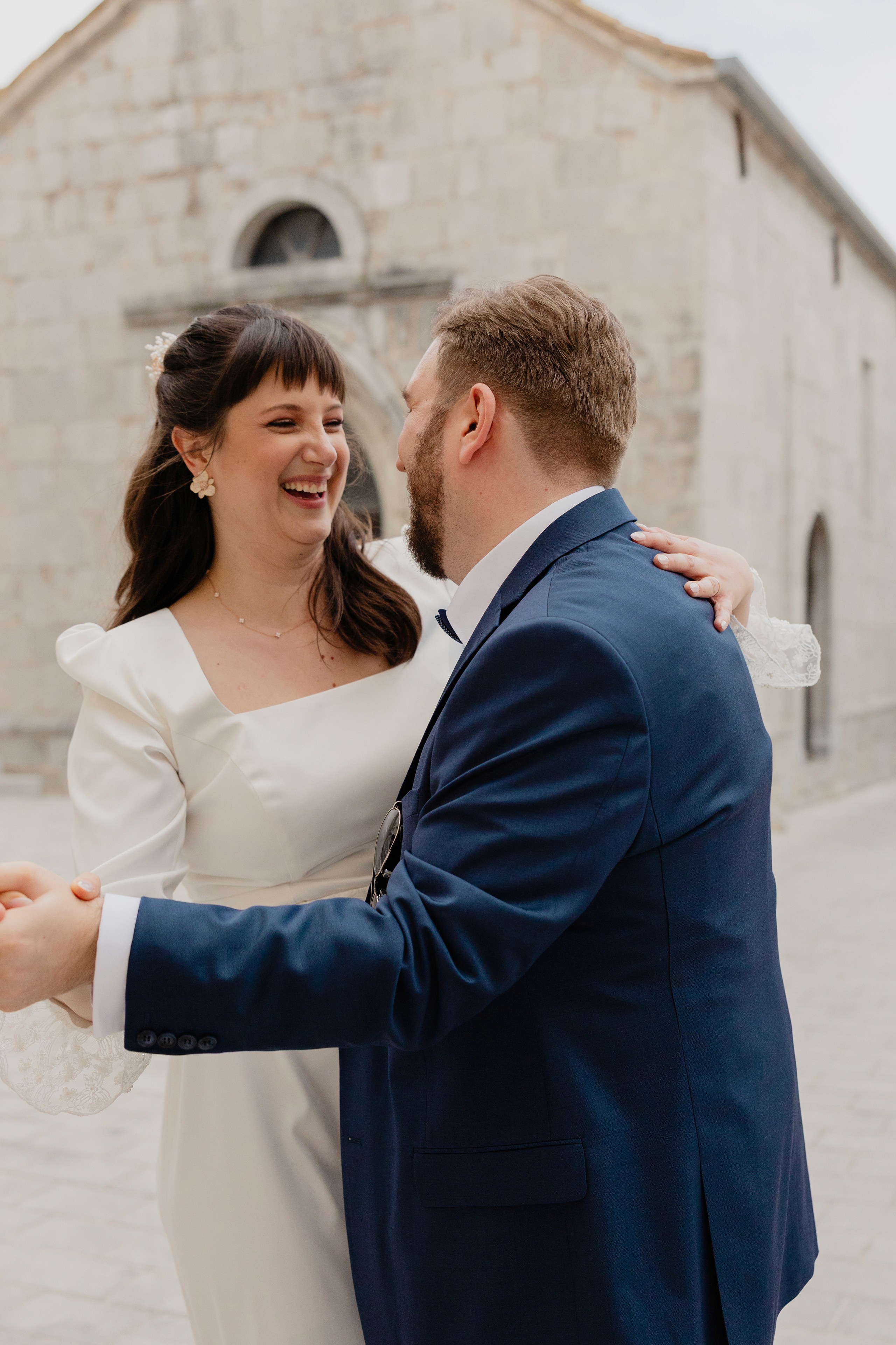 Bride and groom walking up steps together