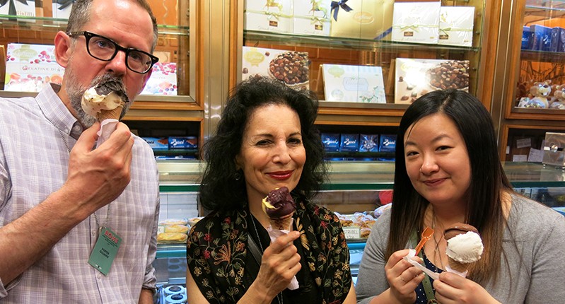 two women and one man eating ice cream
