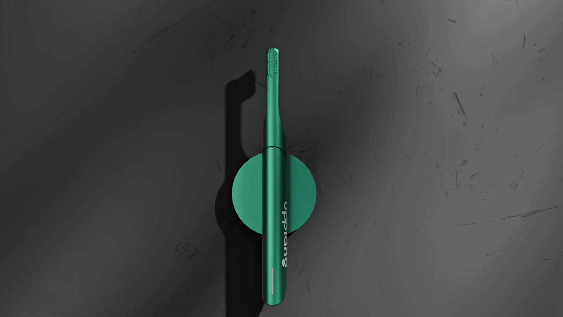 Green toothbrush in a wall-mount arrangement