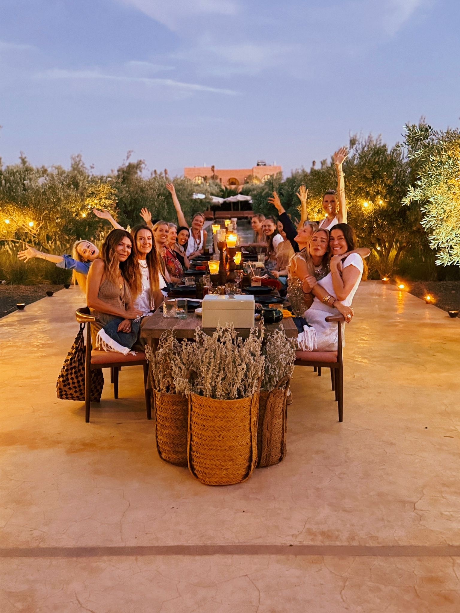 Women gathered around a candlelit table at a retreat