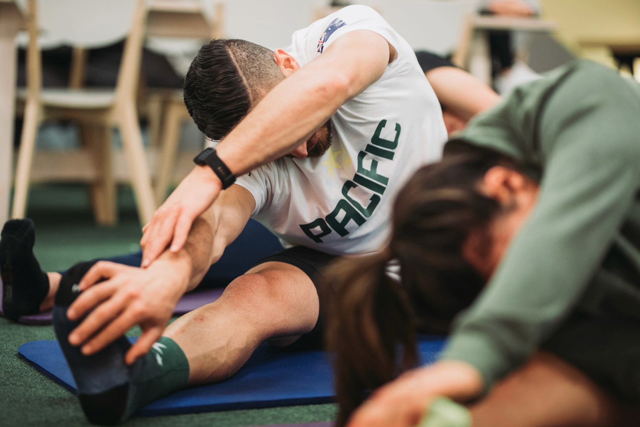 employees stretching before work - Company Wellness Programs