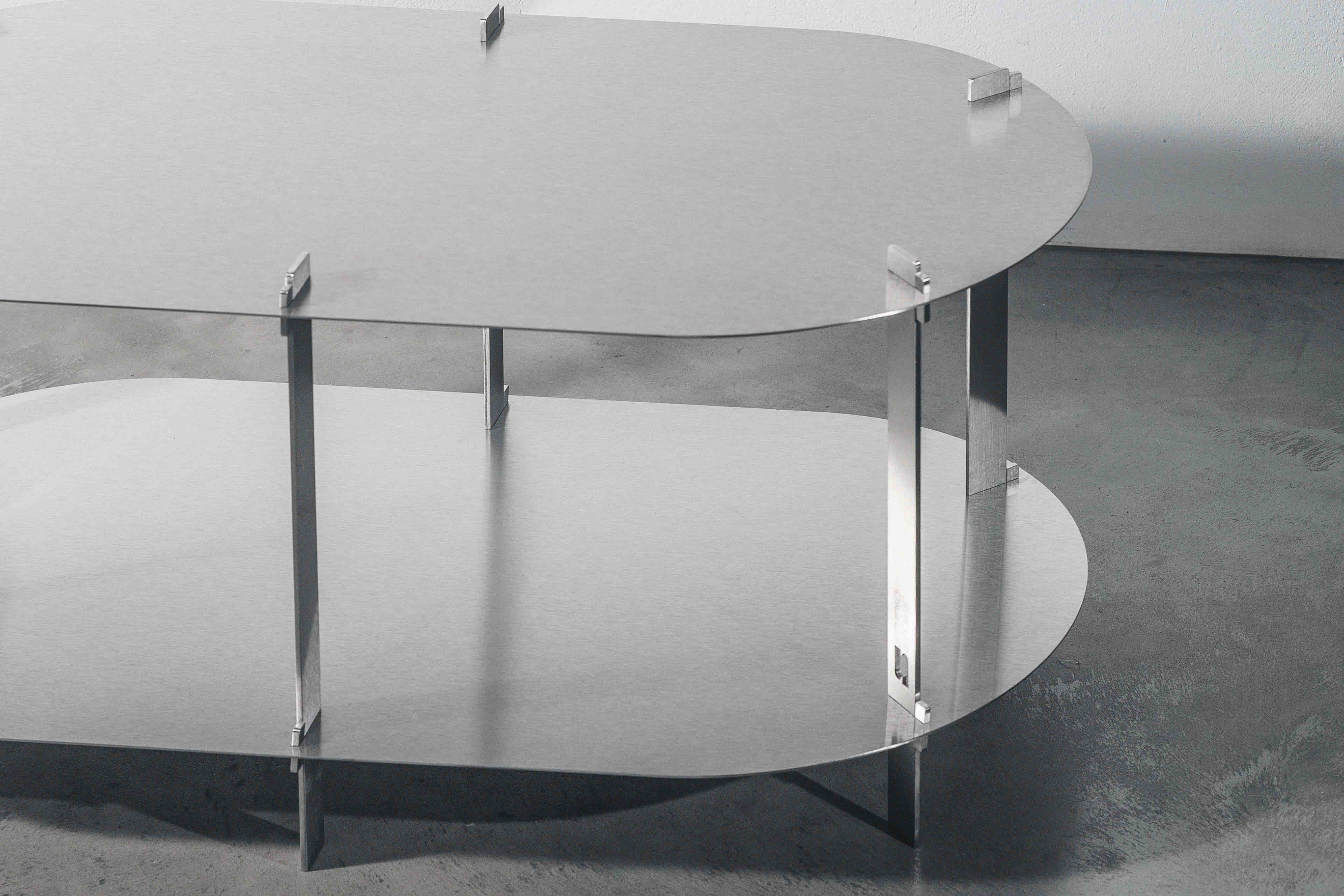 details of a metal designer table on a concrete floor