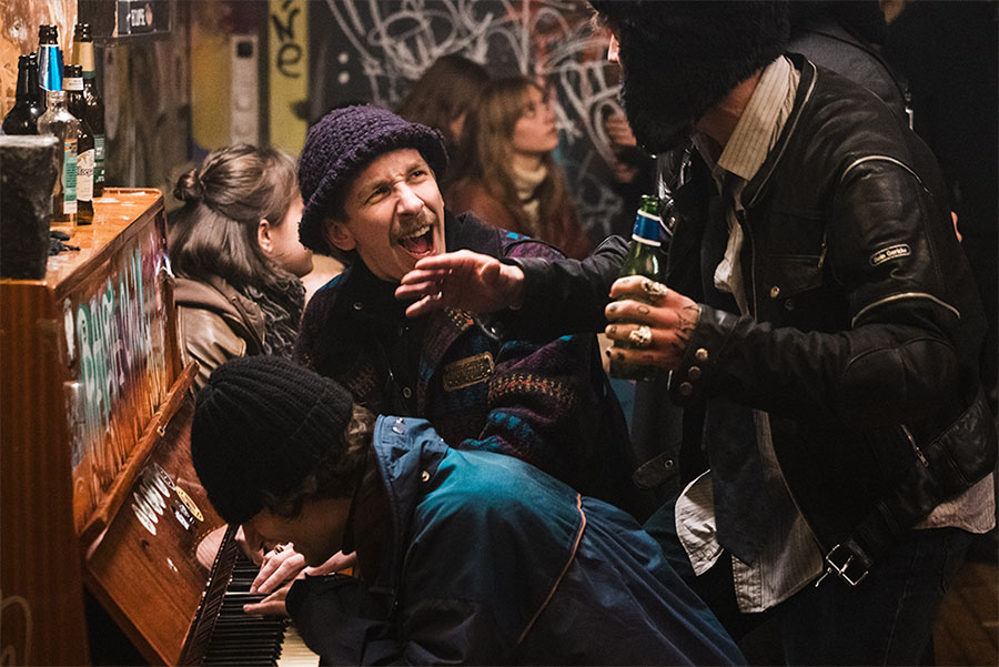 Mihkel Kuusk (Sebastian) and Karl Birnbaum (Silo) laugh while playing piano in Uus Laine bar in Rolling Papers (Pikad paberid), Estonia’s Oscar submission