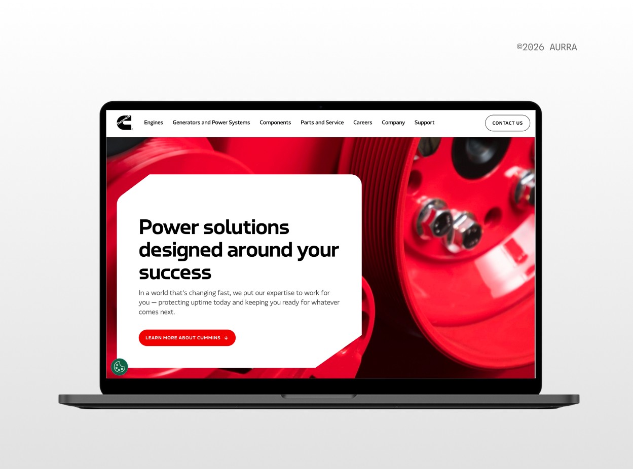 Cummins homepage using red as its primary brand color over a close-up engine component, a common choice in industrial manufacturing