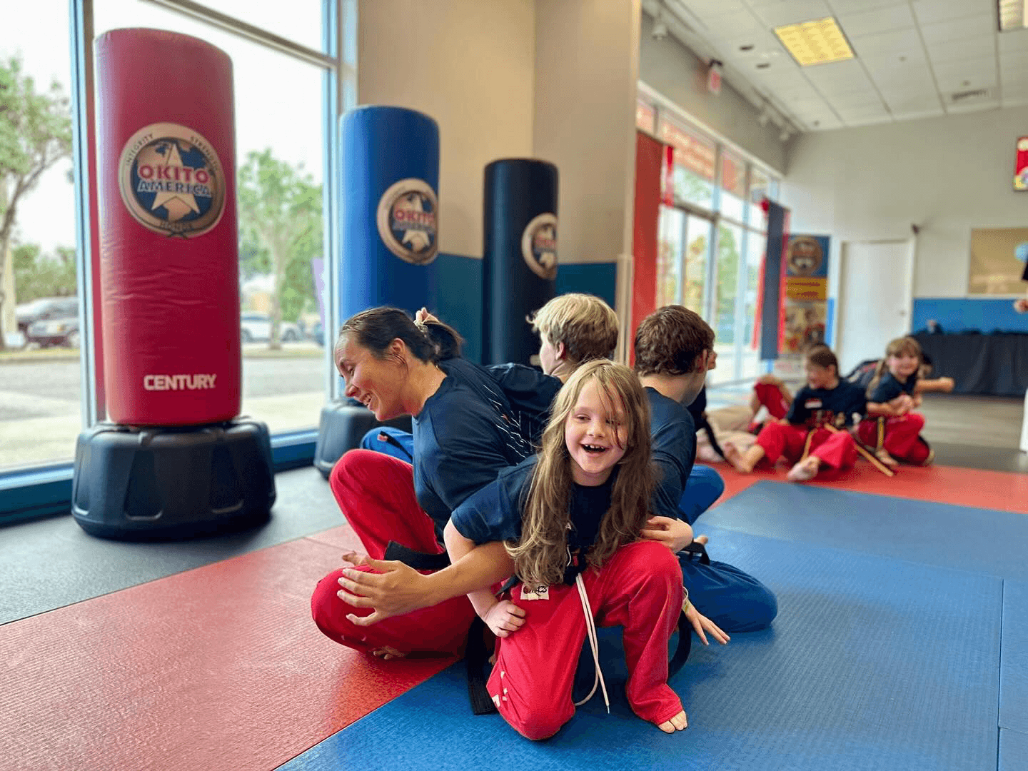 Group of taekwondo class attendees, attempting a group challenge.